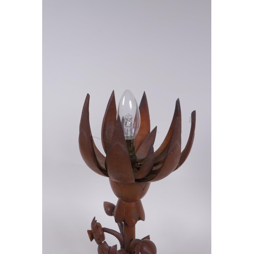 324 - A carved wood lotus flower table lamp, the petals opening to reveal the bulb, 35cm high