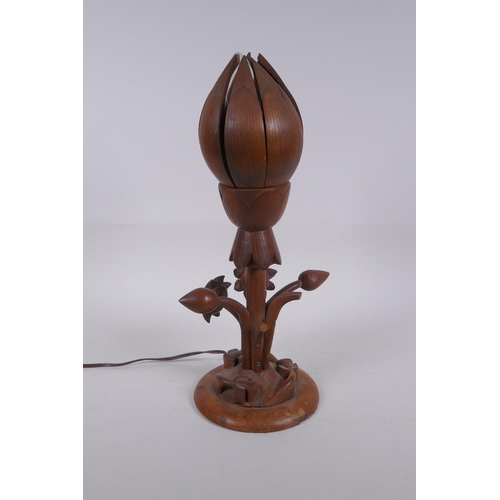 324 - A carved wood lotus flower table lamp, the petals opening to reveal the bulb, 35cm high