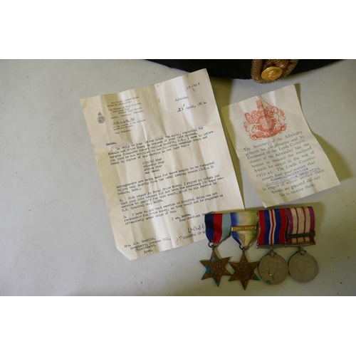 1 - A Royal Navy ship's officer's dress uniform, hat, sword, belt and epaulettes belonging to Surgeon Co... 