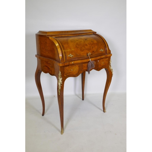 1001 - A rosewood marquetry inlaid bureau, with shaped top and cylinder front, the interior fitted with thr... 