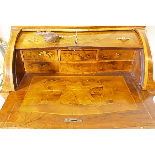 1001 - A rosewood marquetry inlaid bureau, with shaped top and cylinder front, the interior fitted with thr... 