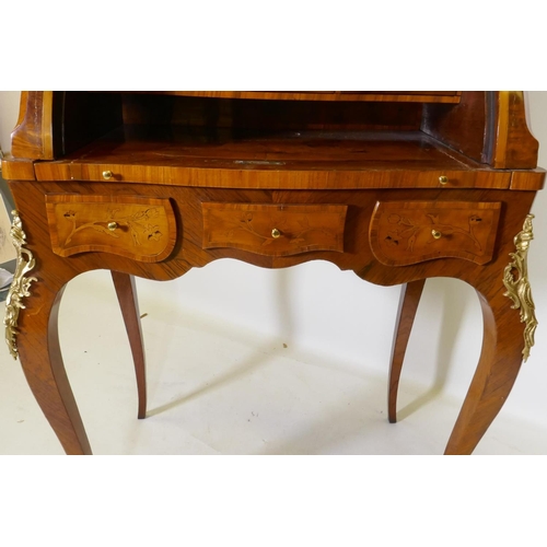 1001 - A rosewood marquetry inlaid bureau, with shaped top and cylinder front, the interior fitted with thr... 