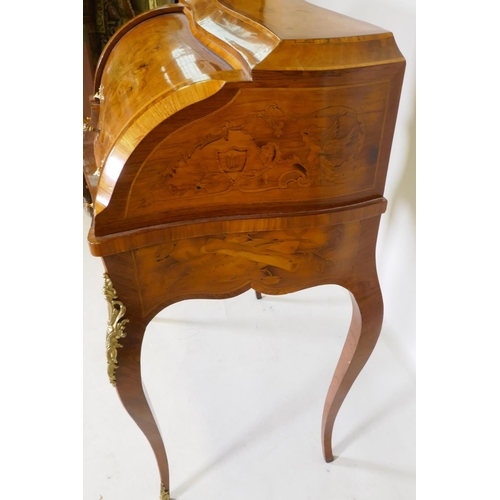 1001 - A rosewood marquetry inlaid bureau, with shaped top and cylinder front, the interior fitted with thr... 