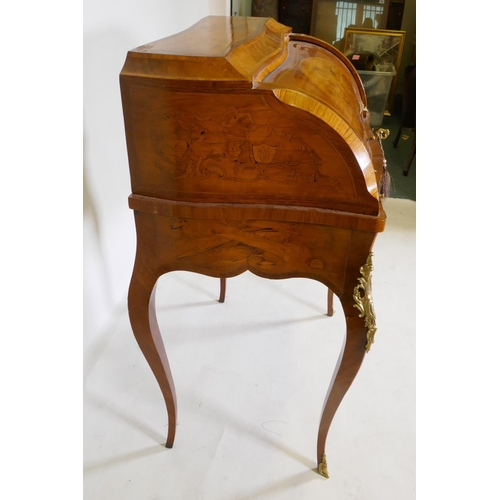 1001 - A rosewood marquetry inlaid bureau, with shaped top and cylinder front, the interior fitted with thr... 