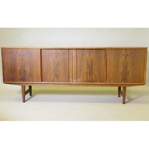 1008 - A mid century Danish sideboard, designed by E.W. Bach for Sejling Skaed Silkeborg, four sliding door... 