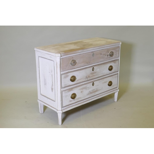 1019 - An antique painted and distressed pine commode, with three long drawers, canted corners and raised o... 