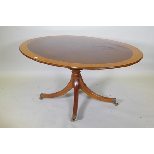 1025 - A Regency style inlaid mahogany breakfast table by William Tillman, with a tilt top, 170 x 118cm, 72... 