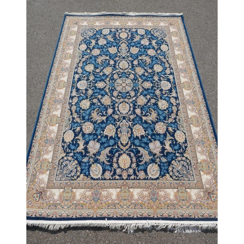 1032 - A fine woven blue and cream ground Persian carpet full pile with traditional allover floral medallio... 