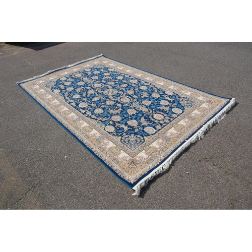 1032 - A fine woven blue and cream ground Persian carpet full pile with traditional allover floral medallio... 