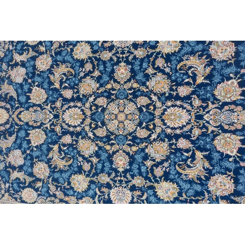 1032 - A fine woven blue and cream ground Persian carpet full pile with traditional allover floral medallio... 