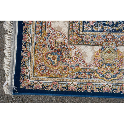 1032 - A fine woven blue and cream ground Persian carpet full pile with traditional allover floral medallio... 