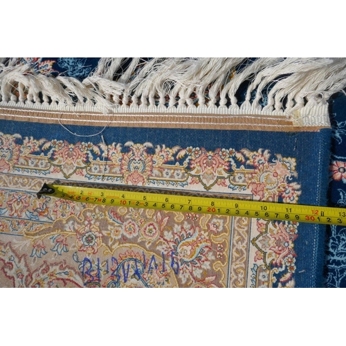 1032 - A fine woven blue and cream ground Persian carpet full pile with traditional allover floral medallio... 