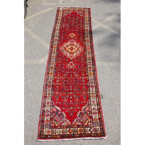 1033 - A rich red ground full heavy pile Iranian runner, AF, 104 x 365cm