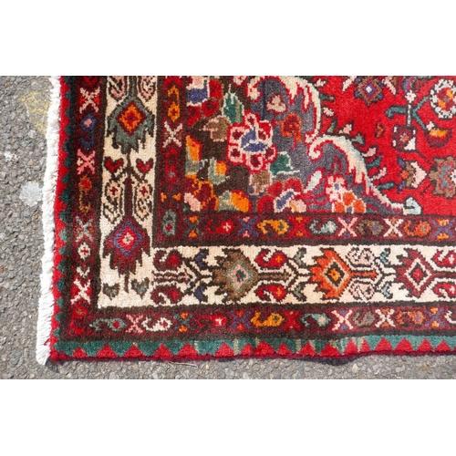 1033 - A rich red ground full heavy pile Iranian runner, AF, 104 x 365cm