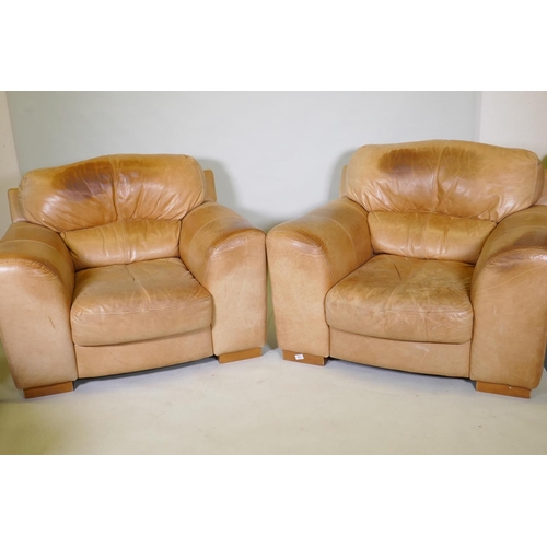 1037 - A pair of contemporary leather easy chairs