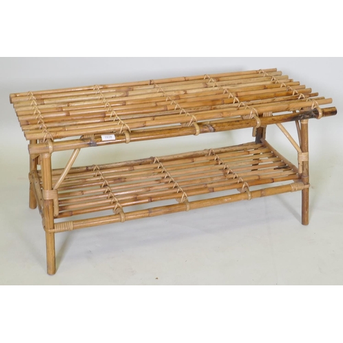 1038 - A two tier bamboo occasional table, 102 x 48cm, 45cm high