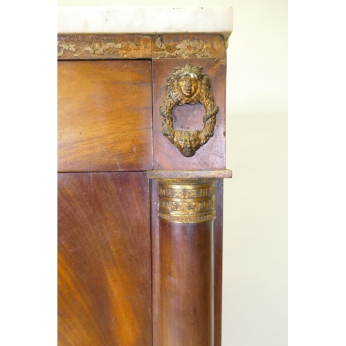 1041 - A C19th continental figured mahogany secretaire a abattant with ormolu mounts and marble top over si... 