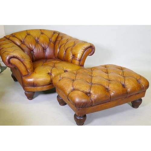 1044 - A Tetrad button leather easy chair and footstool