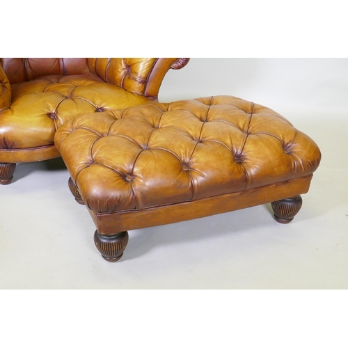 1044 - A Tetrad button leather easy chair and footstool