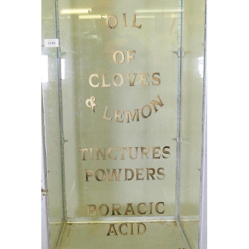 1048 - A mid century glass display cabinet on stand with painted decoration, 57 x 58cm, 218cm high