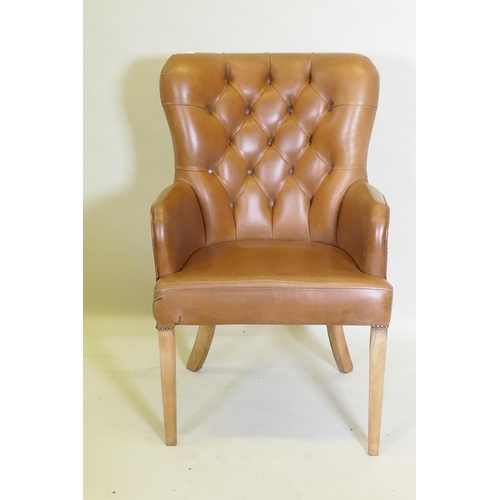 1050 - A leather button back desk chair, AF