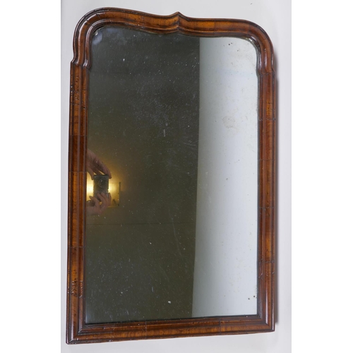 1051 - An antique walnut wall mirror,, 46 x 71cm