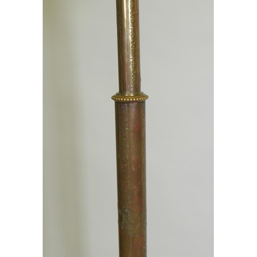 1054 - A pair of brass floor lamps with directional function, now AF, 146cm high