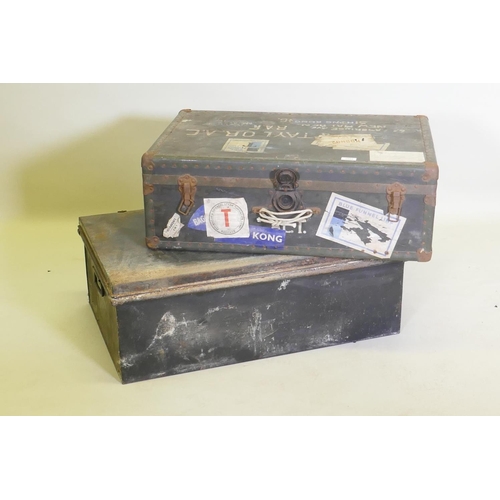 1055 - A vintage metal strapped travel trunk adorned with various cabin labels, together with a large metal... 