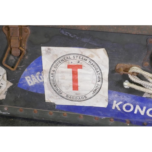 1055 - A vintage metal strapped travel trunk adorned with various cabin labels, together with a large metal... 