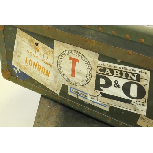 1055 - A vintage metal strapped travel trunk adorned with various cabin labels, together with a large metal... 