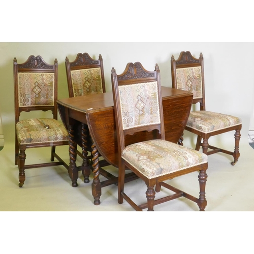 1057 - A c19th oak gateleg table with barley twist supports, and four oak dining chairs with carved and flu... 