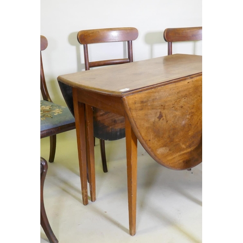 1058 - A George III mahogany drop leaf table and a set of six mahogany dining chairs with bar backs and dro... 