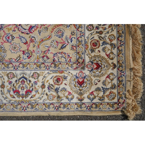 1065 - A gold ground full pile Kashmir rug with floral medallion design, 156 x 230cm