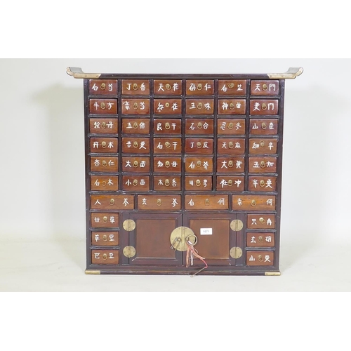 1071 - A Japanese hardwood and brass mounted apothecary cabinet, 77x 24cm