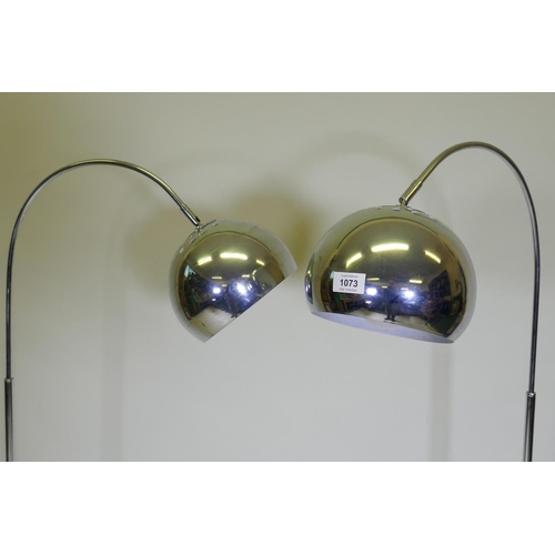 1073 - A pair of contemporary chromed metal floor lamps, 146cm high