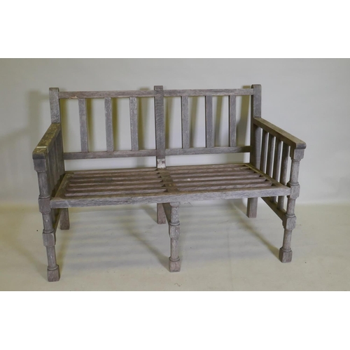 1082 - A slatted teak garden bench, 125 x 62cm, 84cm high