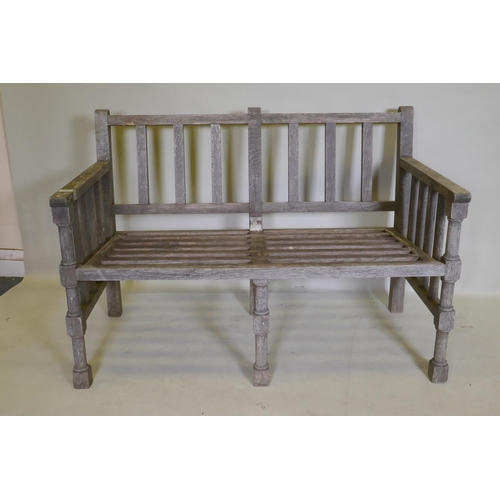 1082 - A slatted teak garden bench, 125 x 62cm, 84cm high