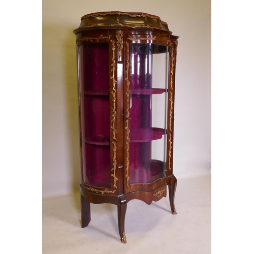 1083 - A C19th serpentine fronted tulipwood vitrine with ormolu mounts, 96 x 44cm, 155cm high