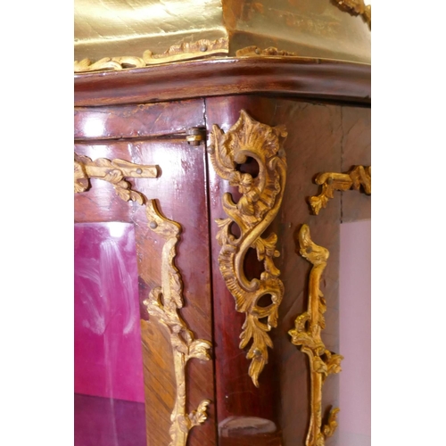 1083 - A C19th serpentine fronted tulipwood vitrine with ormolu mounts, 96 x 44cm, 155cm high