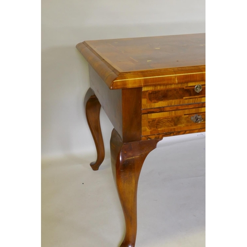 1086 - A continental walnut and marquetry inlaid bureau plat, with five drawers, raised on cabriole support... 