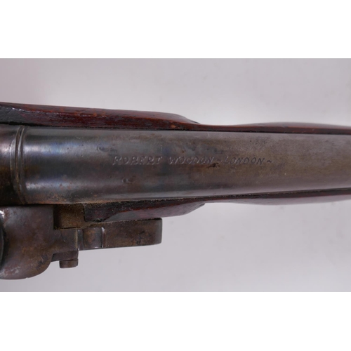 109 - A late C18th flintlock pistol, inscribed on the barrel Robert Wogdon, London, the round barrel with ... 