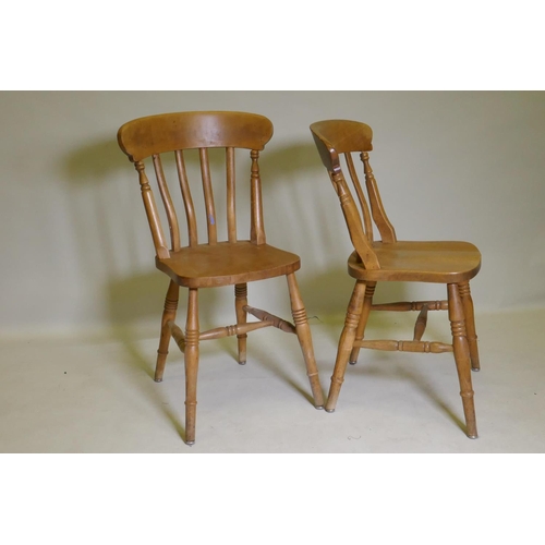 1090 - A pine farmhouse table, raised on turned supports, 213 x 120cm, and seven lathe back Windsor chairs