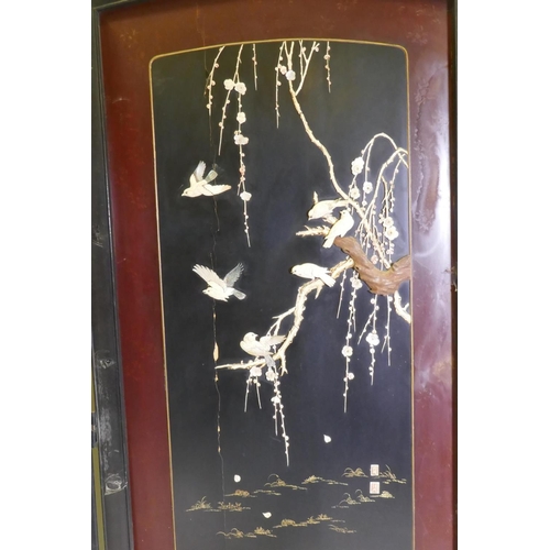 1092 - A Meiji period two fold lacquer screen, with raised decoration of birds and blossom in bone, mother ... 