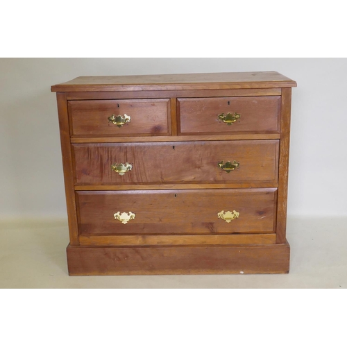 1093 - A Victorian walnut chest of two over two drawers, with moulded fronts and brass handles, raised on a... 