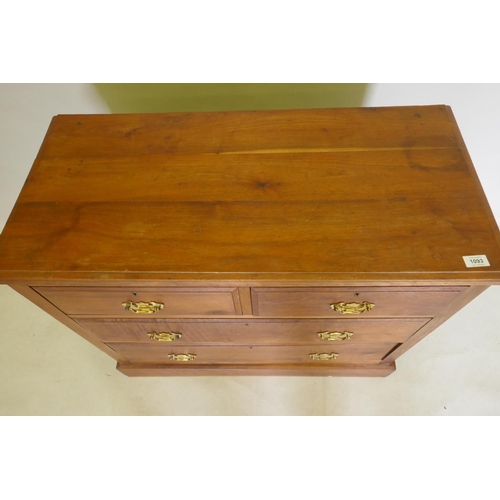 1093 - A Victorian walnut chest of two over two drawers, with moulded fronts and brass handles, raised on a... 