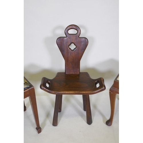 1095 - An elm birthing chair, together with two mahogany piano stools