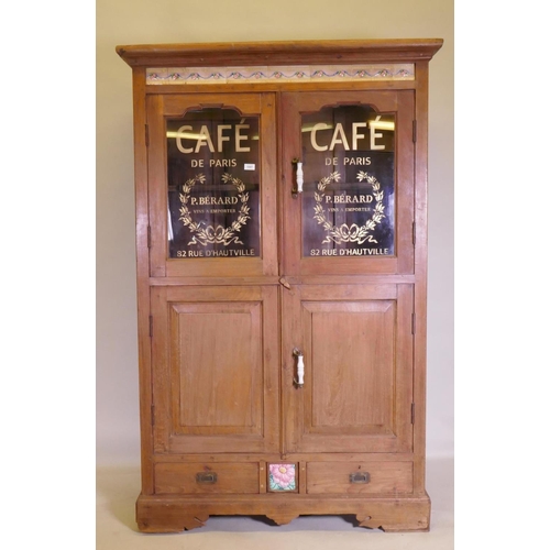 1097 - An antique teak cabinet with glazed and painted doors to the upper section and a tiled frieze, 118 x... 