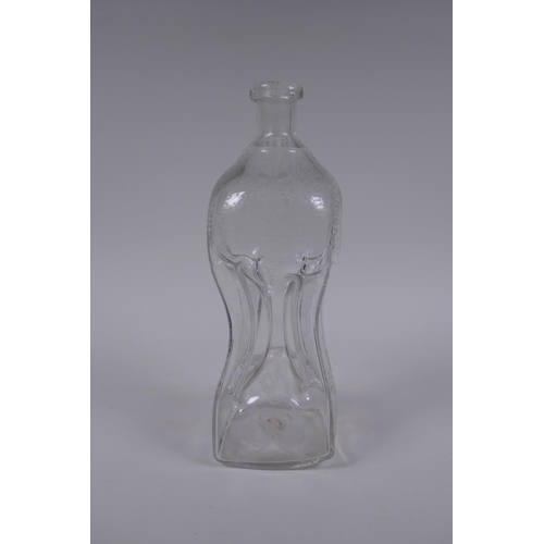 117 - An antique glass bottle of pinched waist form and etched decoration, 28cm high