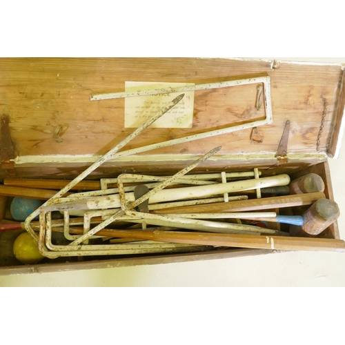 119 - An antique croquet set, appears complete, boxed