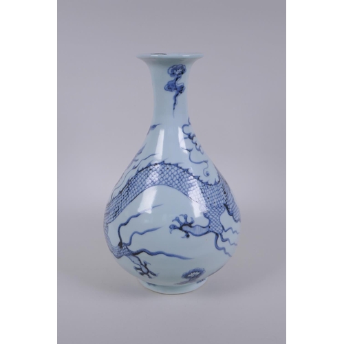 121 - A Chinese blue and white porcelain pear shaped vase, decorated with a dragon in flight, 32cm high